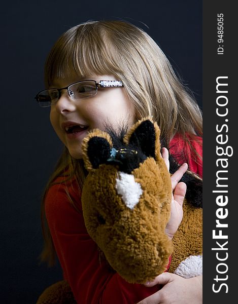 Half body portrait of young girl holding stuffed toy. Half body portrait of young girl holding stuffed toy.