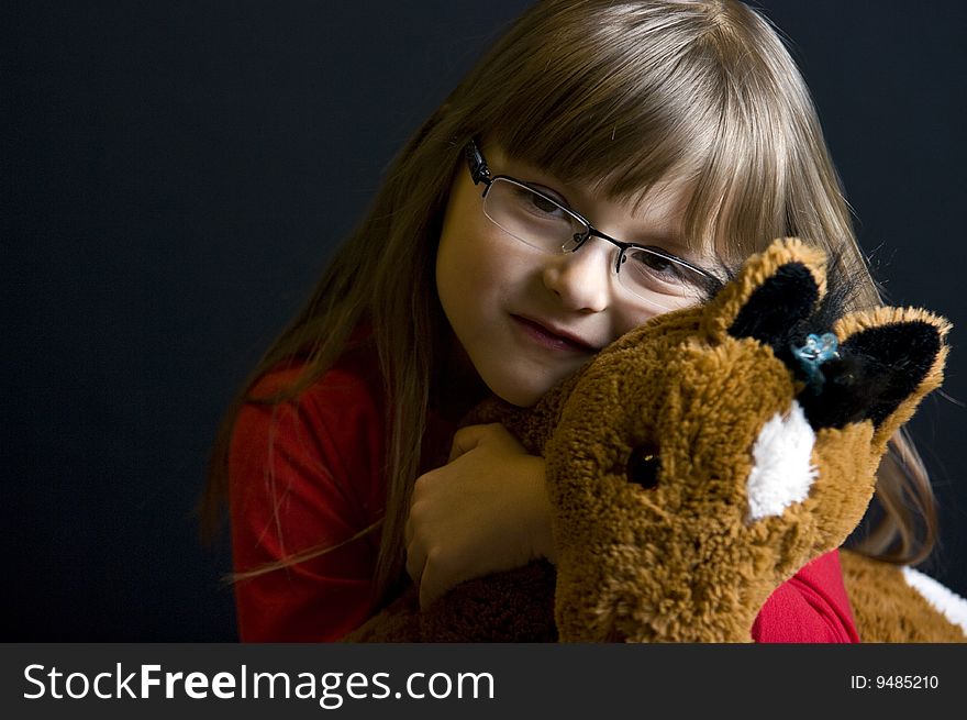 Half body portrait of young girl holding stuffed toy. Half body portrait of young girl holding stuffed toy.