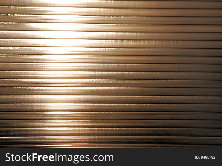 Illuminated steel shutters shot horizontally. Illuminated steel shutters shot horizontally.