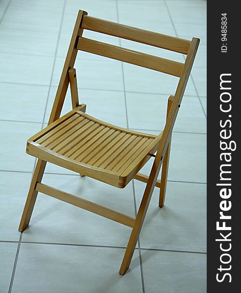 Wooden single chair on the floor. Wooden single chair on the floor.
