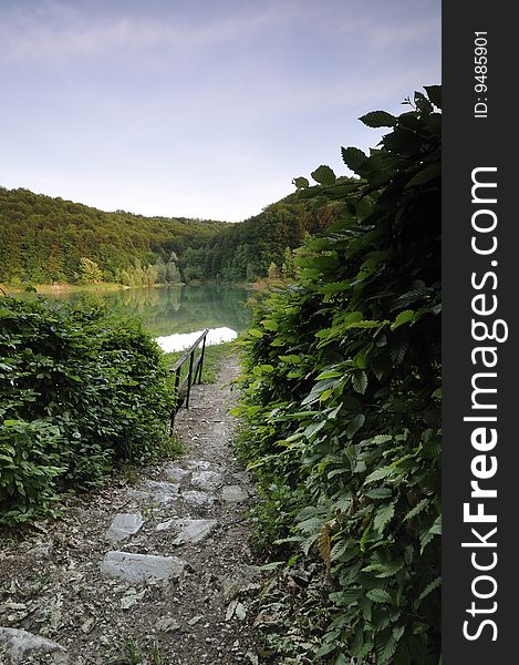 Entrance that leads to the walking path around the lake. Entrance that leads to the walking path around the lake