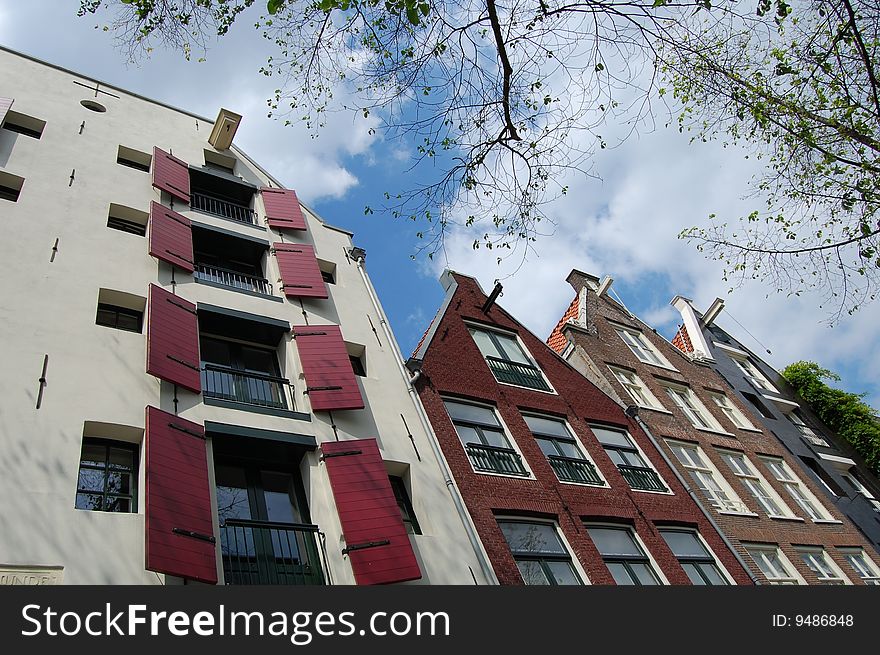 Nice package store House at a canal in Amsterdam. Nice package store House at a canal in Amsterdam.