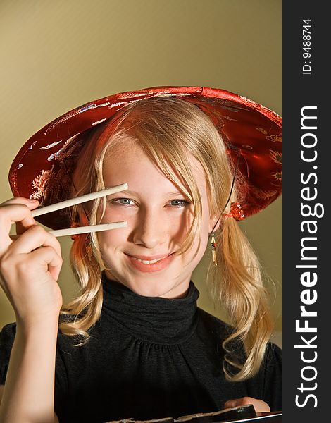 A smiling girl with chopsticks. A smiling girl with chopsticks