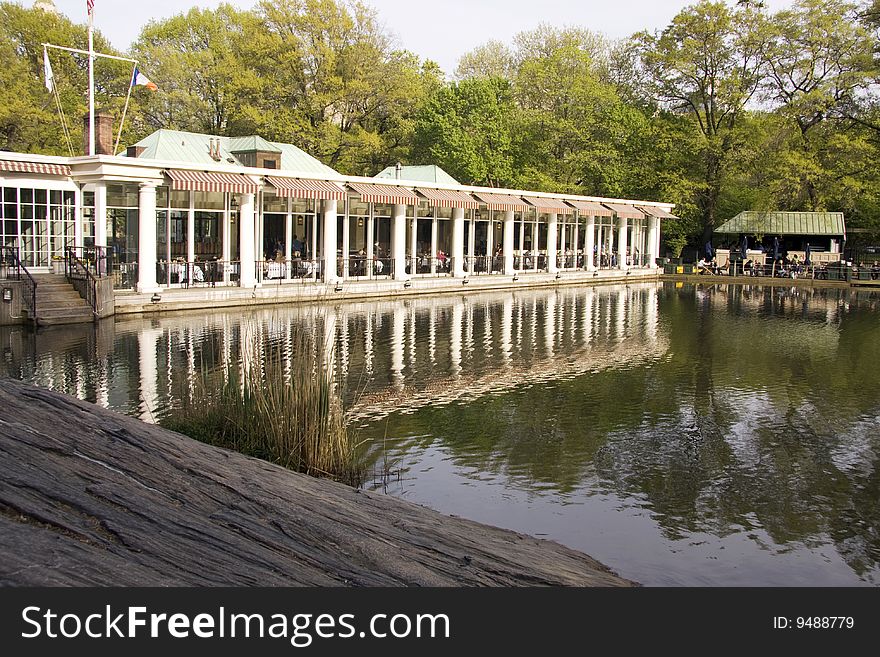 Building near a lake and a forest