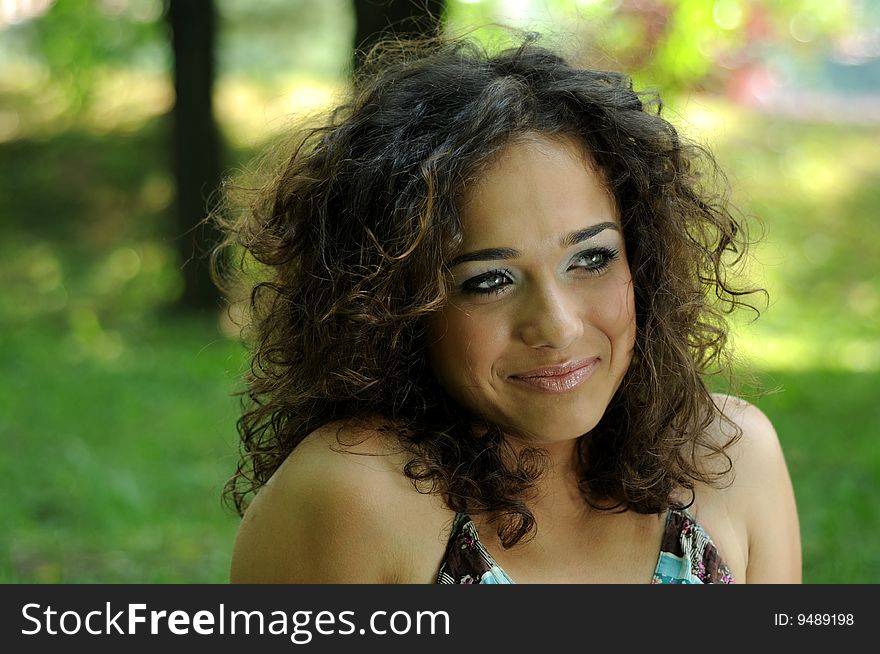 Smile teen standing on field in a park