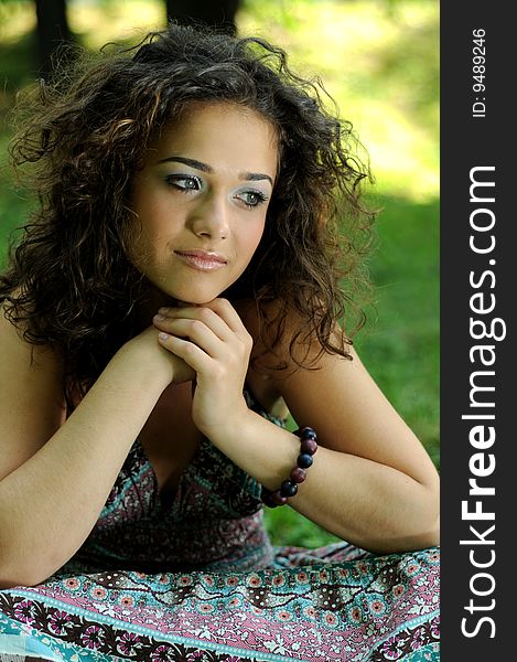 Smile teen standing on field in a park