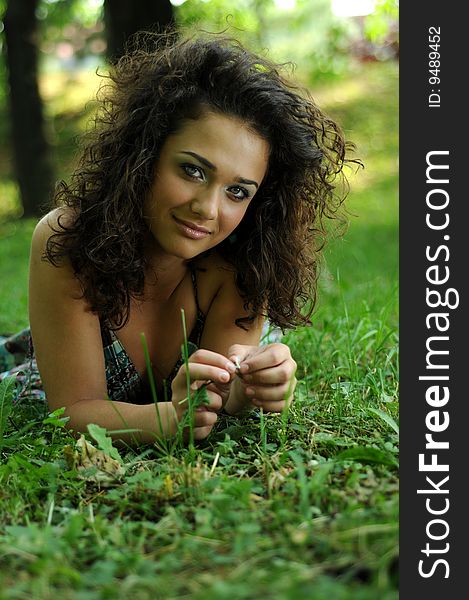 Smile teen standing on field in a park