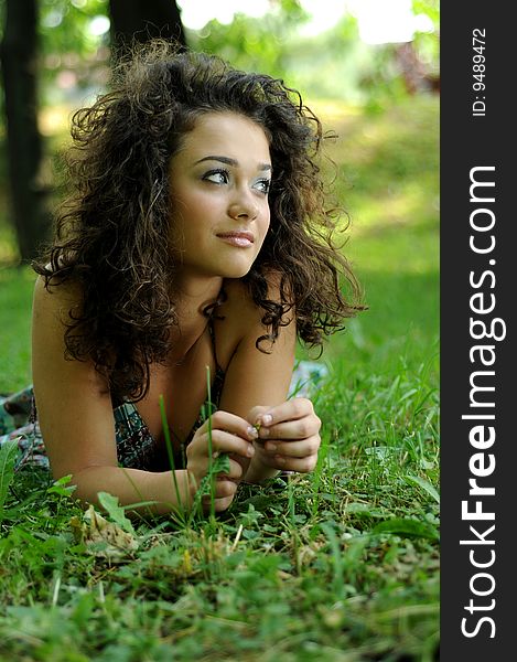 Smile teen standing on field in a park