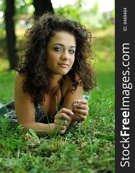 Smile teen standing on field in a park