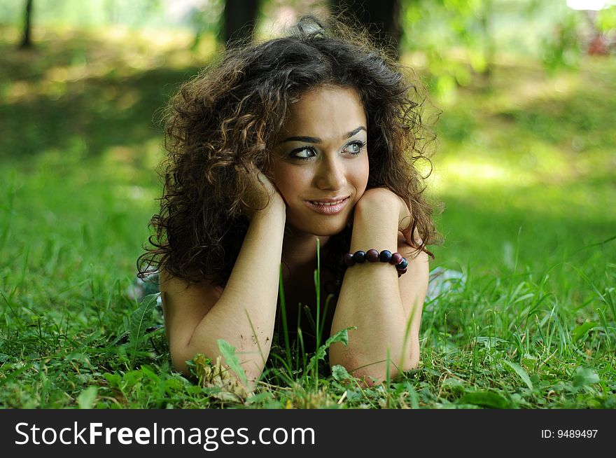 Smile teen standing on field in a park