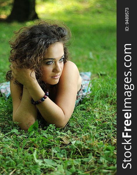 Smile teen standing on field in a park