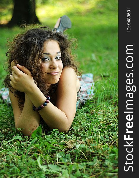 Smile teen standing on field in a park