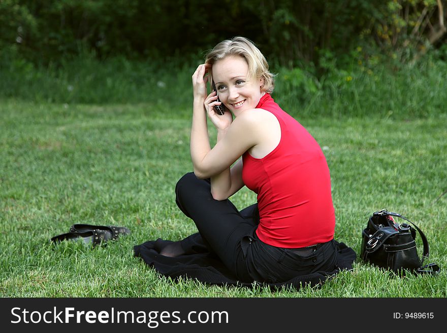 Woman Talks On A Mobile Phone