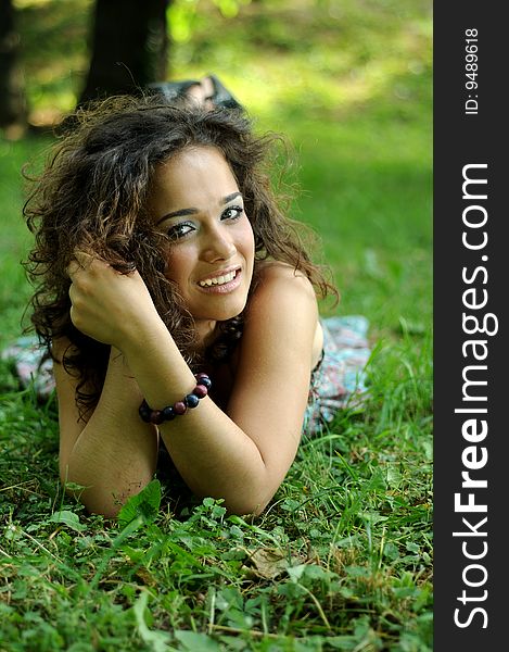 Smile teen standing on field in a park