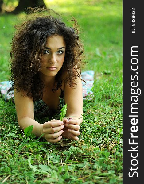 Smile teen standing on field in a park