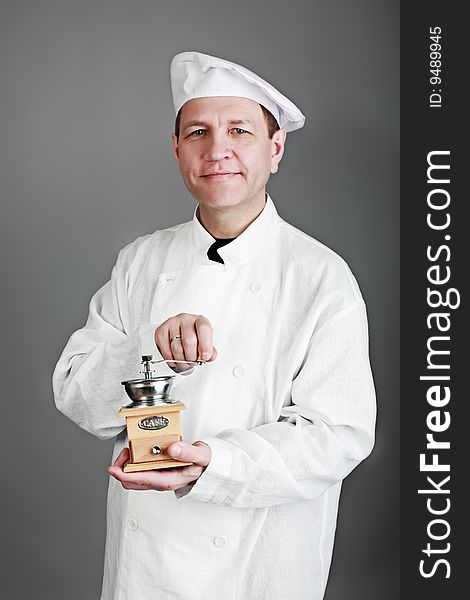 Portrait of an aged professional male cook. Shot in a studio. Portrait of an aged professional male cook. Shot in a studio.