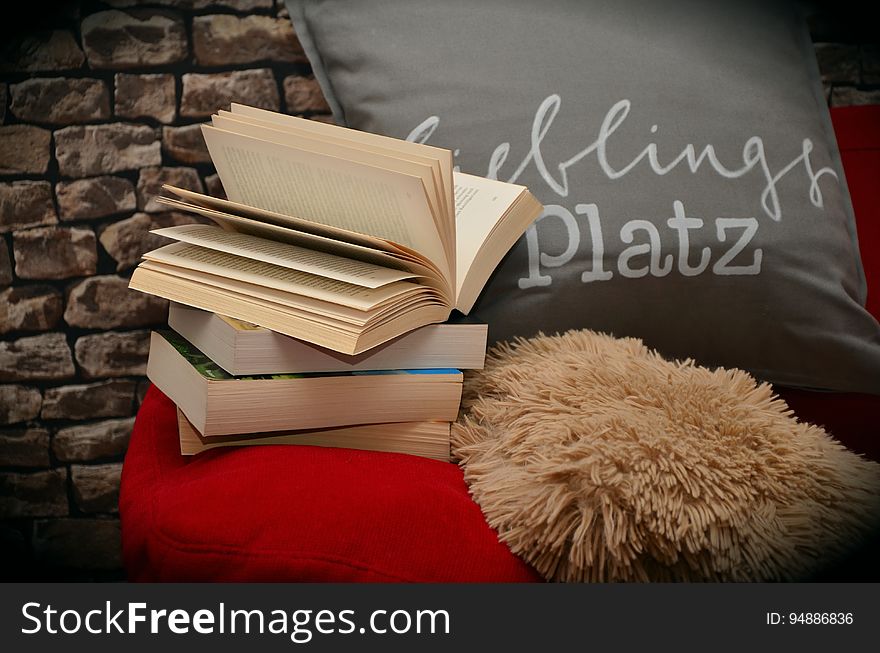 Books on a pillow in a corner. Books on a pillow in a corner.