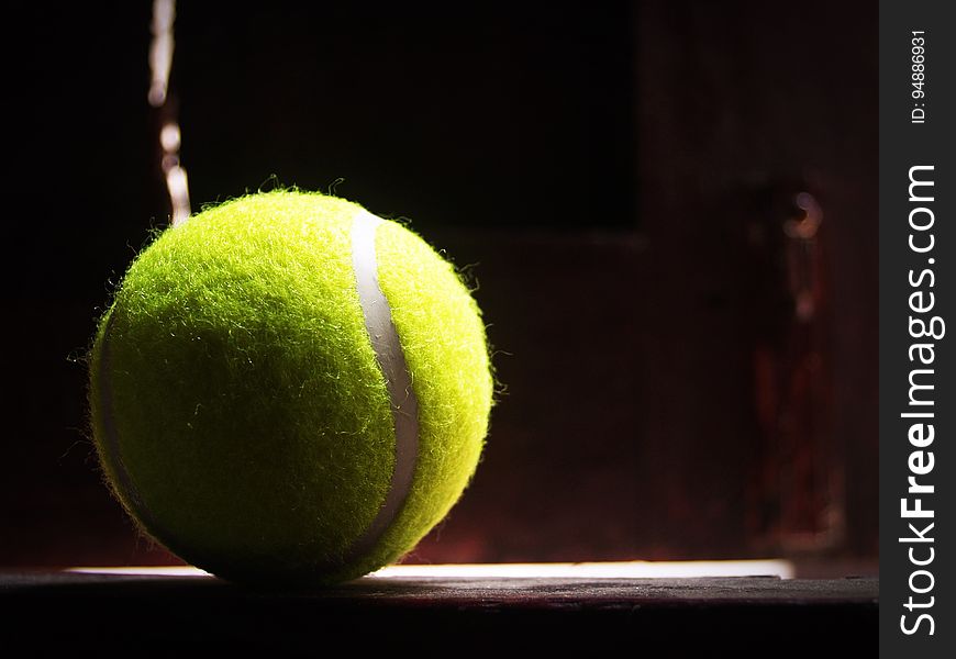 A tennis ball in a ray of sunlight. A tennis ball in a ray of sunlight.