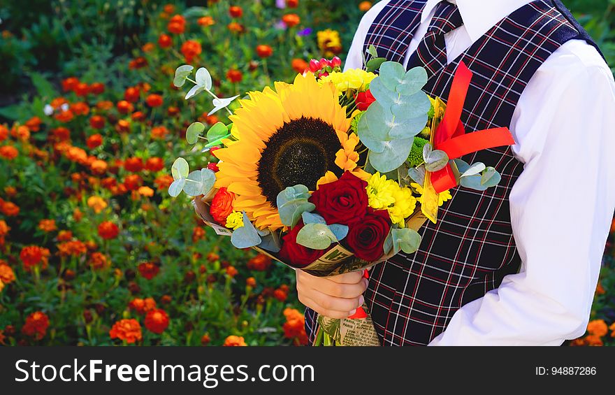 Boy With Bouquet Of Flowers