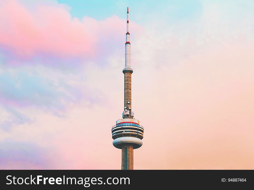 The CN tower against colorful clouds in Toronto, Canada.