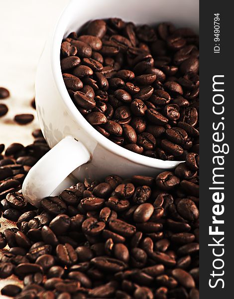 Coffee background: Close-up of beans, cup mill. Coffee background: Close-up of beans, cup mill