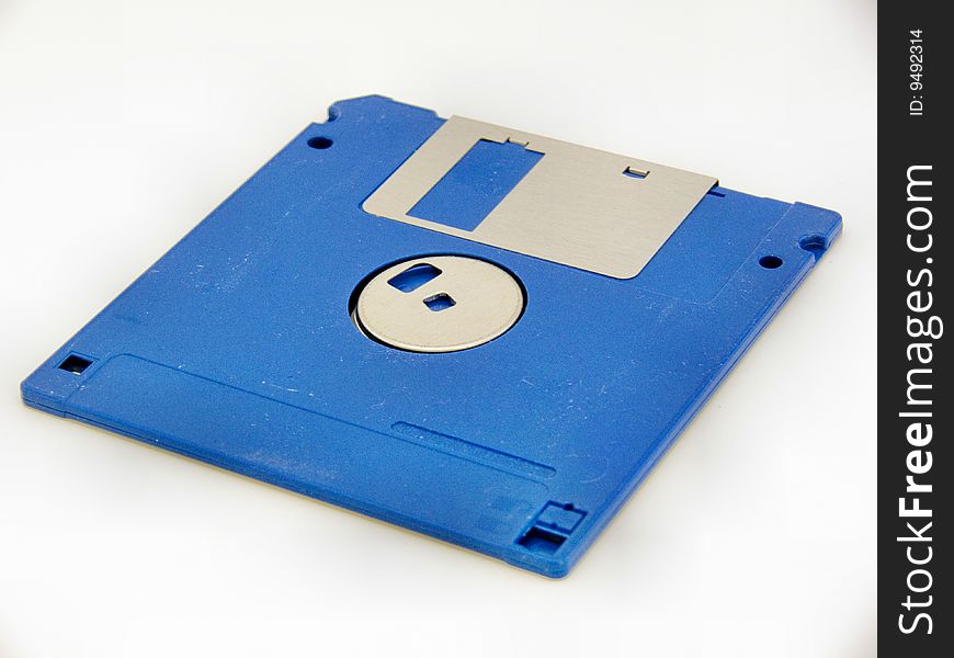 Vintage 3ï¿½-inch blue computer floppy disk with metal inlay. Vintage 3ï¿½-inch blue computer floppy disk with metal inlay