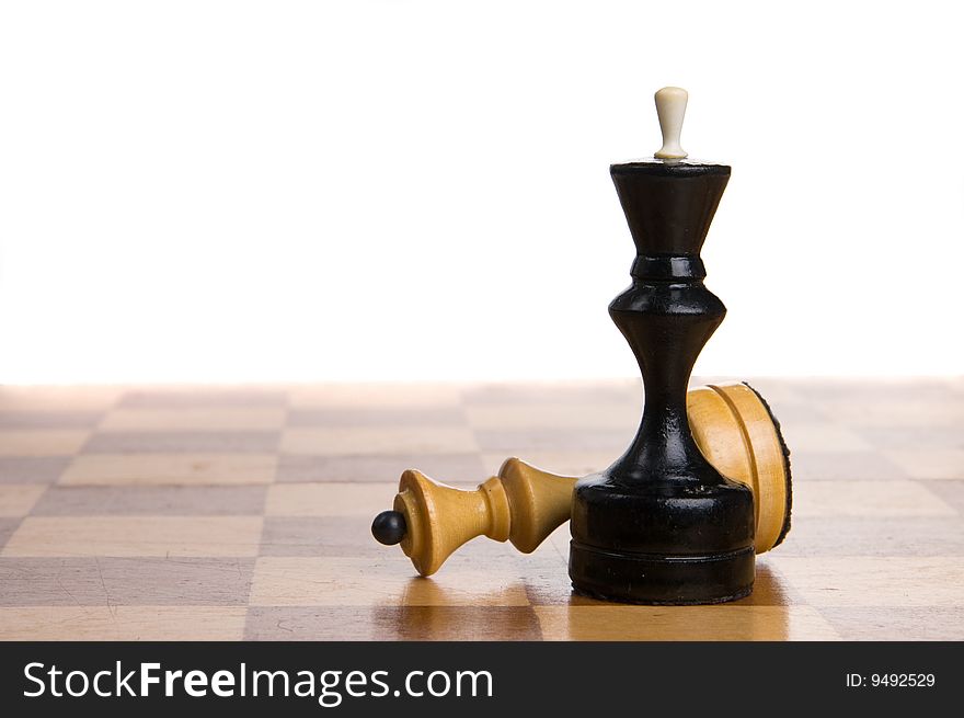 Two chessmen on a chessboard, white background