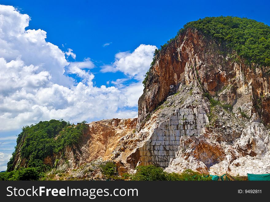 Asia Marble Quarry with Blue Cloudy Sky. Asia Marble Quarry with Blue Cloudy Sky