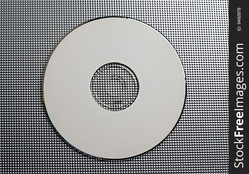 Musical disk on a grey background