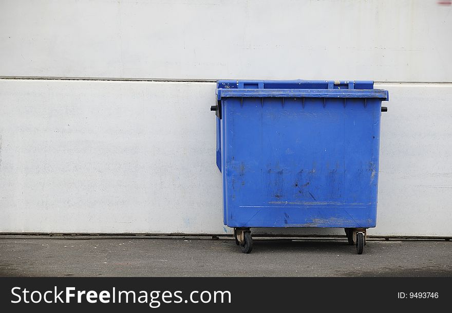 Blue Bucket of garbage on white background