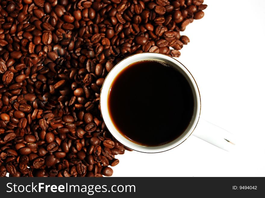 Coffee cup and grain on white background. Coffee cup and grain on white background