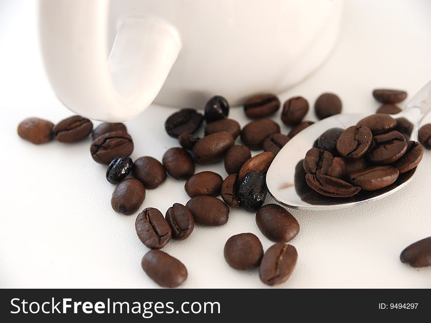 Cup of coffee. Coffee beans on white background