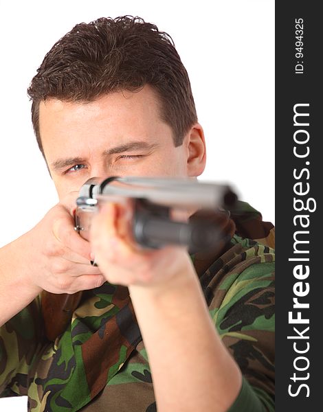 Man in camouflage  pointed from gun on white background