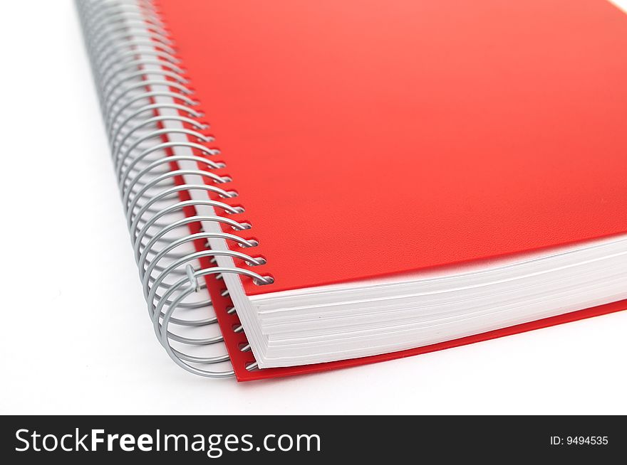Red notebook on white background