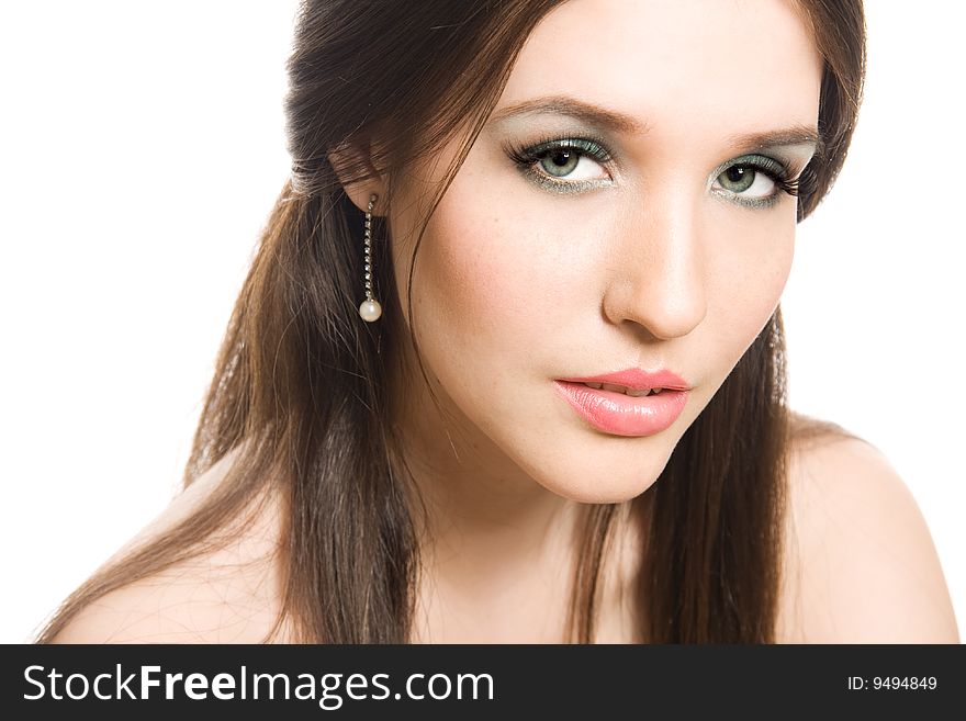 Beautiful young brunette with bright makeup andlong hair isolated on white background. Beautiful young brunette with bright makeup andlong hair isolated on white background