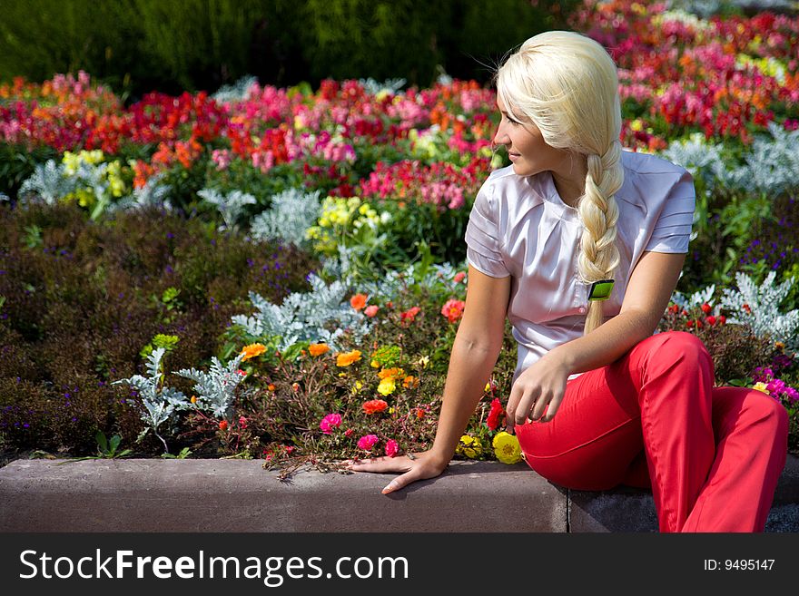 Young blond caucasian woman in park. Young blond caucasian woman in park