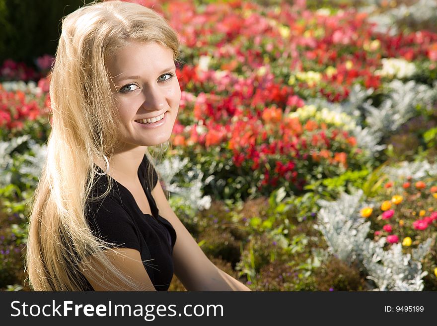 Young Blond Woman In Park