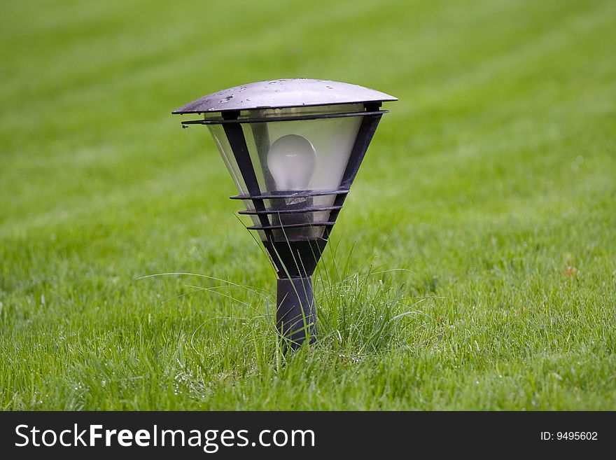 Street lamp on the green grass