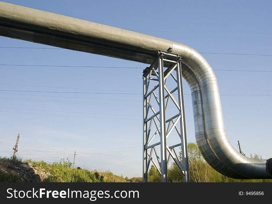 Industrial pipelines against blue sky.