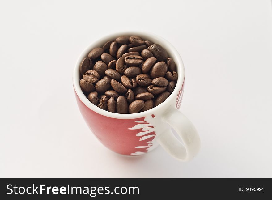 Coffee beans and red cup. Coffee beans and red cup.