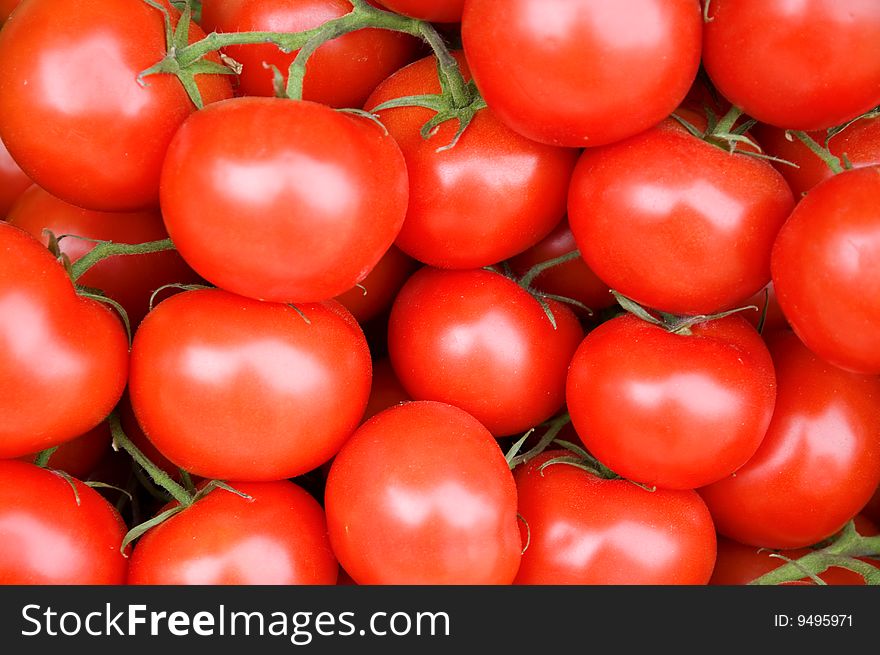 Red ripe tomatoes for background