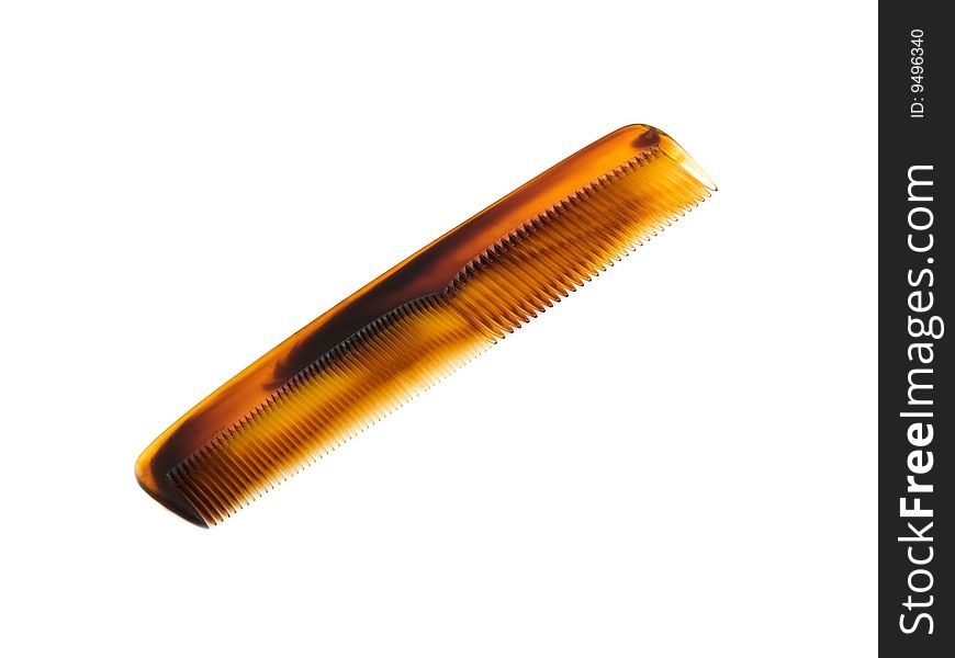 Plastic tortoise shell type hair comb isolated on white