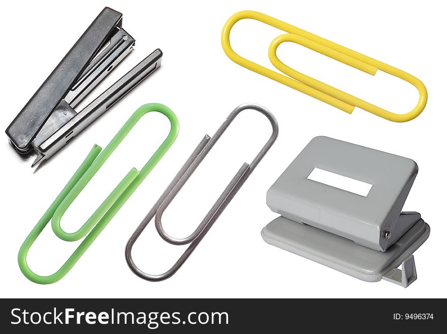 Stapler, puncher and paper clips under the white background