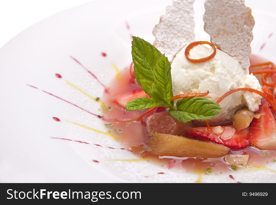 Gourmet ice cream with strawberries on plate isolated