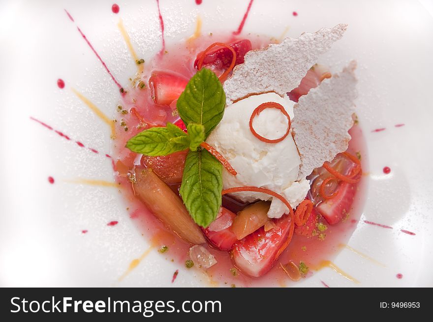 Gourmet ice cream with strawberries on plate isolated