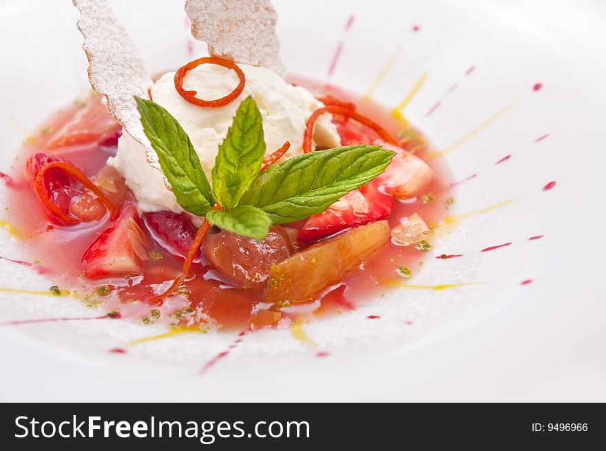 Gourmet ice cream with strawberries on plate isolated