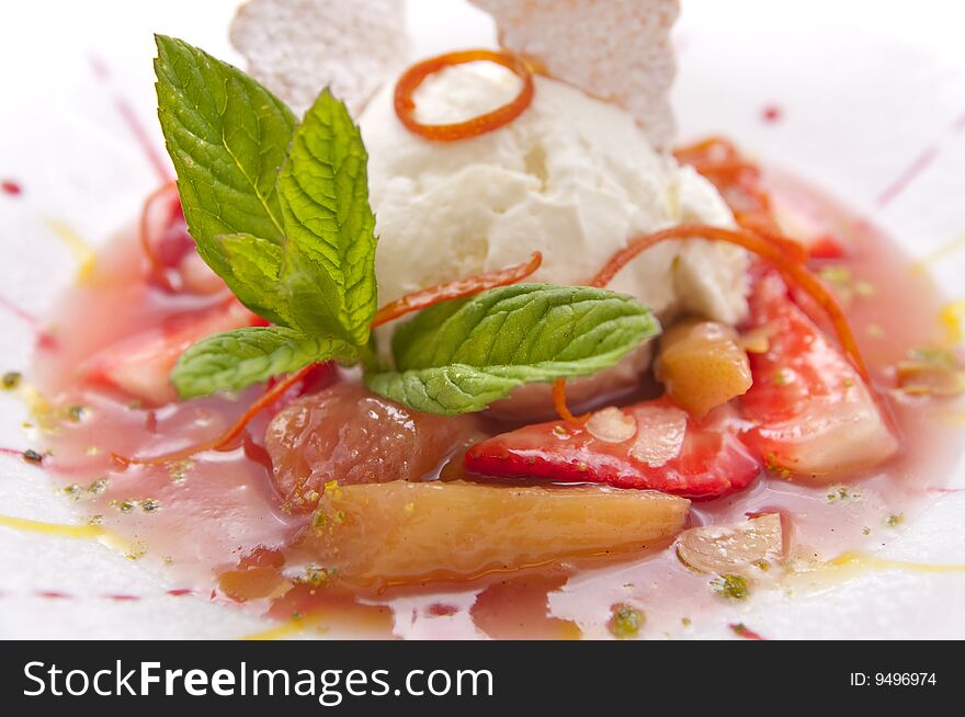 Gourmet ice cream with strawberries on plate isolated