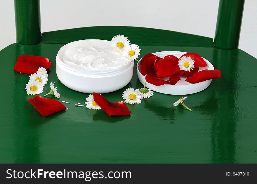 White cream round box with flower plant details. White cream round box with flower plant details