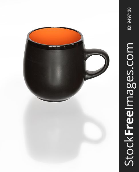 Nice black cup with reverberation isolated on white background with clipping path