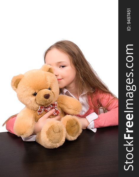 Little girl with teddy bear isolated over white with clipping path